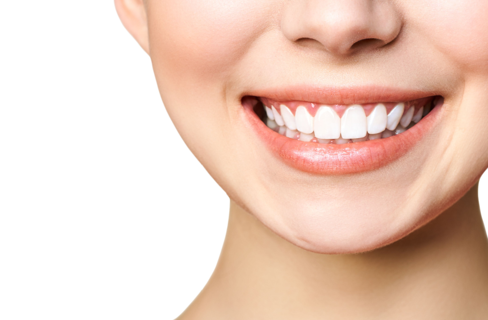 A close-up smile of a young woman showing her beautiful white teeth.